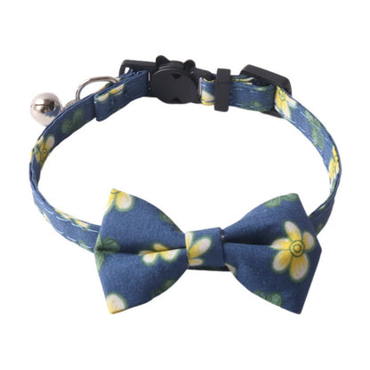 Mokka adjustable floral bow tie cat collar worn by a cat with pink and white flower pattern