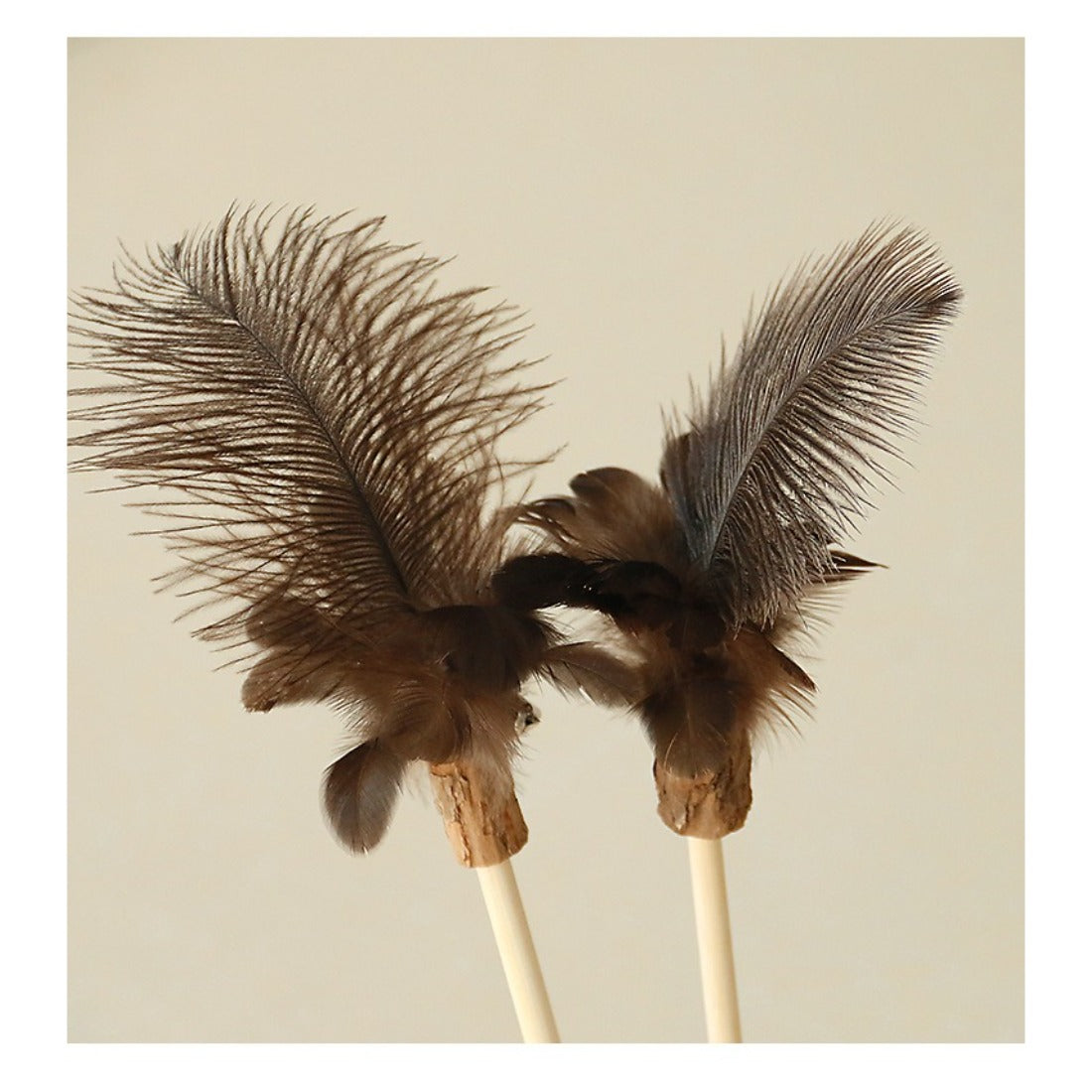 Moo Interactive Feather Wand Cat Toy held in hand showing size and feather details