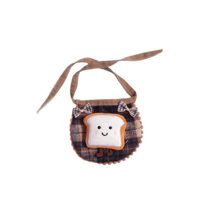 Mokka cat bib worn by a baby, showing fit and coverage during feeding