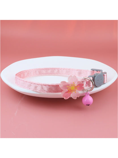 Side view of Mokka pastel flower bell cat collar showing adjustable buckle