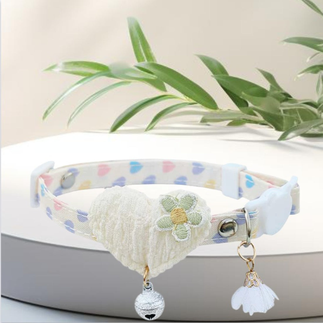 Mokka Heart Floral Charm Cat Collar with bell shown in natural light