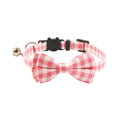 Mokka cat collar with floral and gingham bow arranged on neutral surface