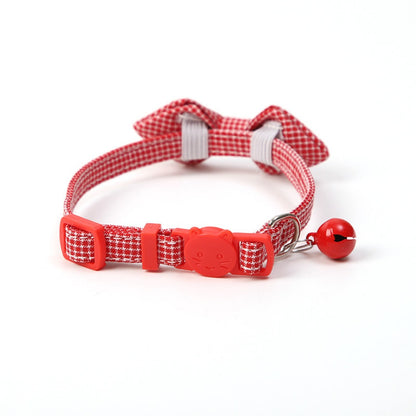 Mokka gingham bow tie cat collar with bell isolated on plain background
