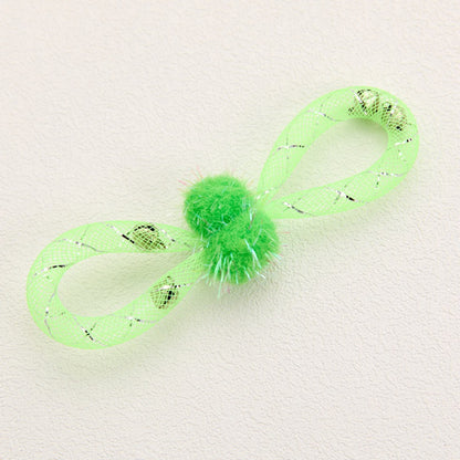 Side view of Moo mesh and pom-pom cat toy highlighting the pom-pom size and mesh shape