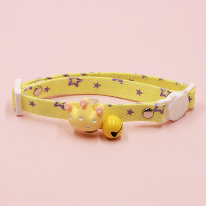 Detailed shot of the collar's adjustable strap and charm