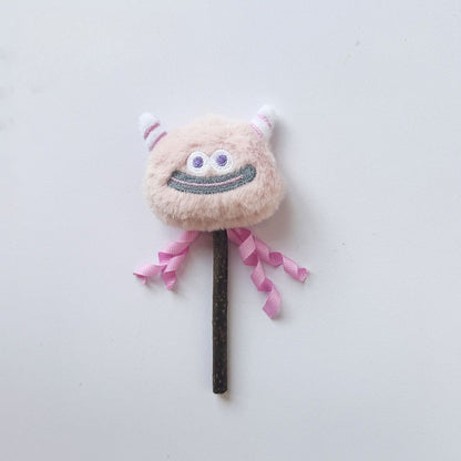 Side view of Moo monster cat stick toy highlighting plush monster head and feathers