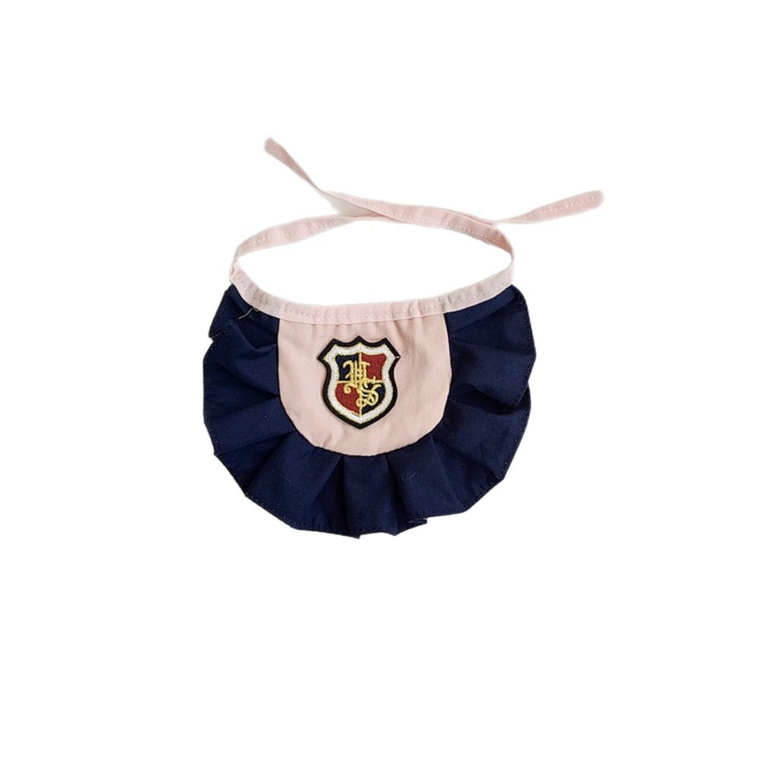 Mokka Academy Badge Cat Bib folded neatly to show compact size and badge detail