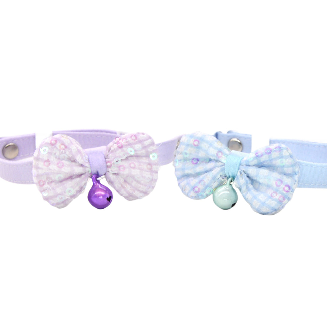 Pastel pink cat collar with a bow and small bell on a white background