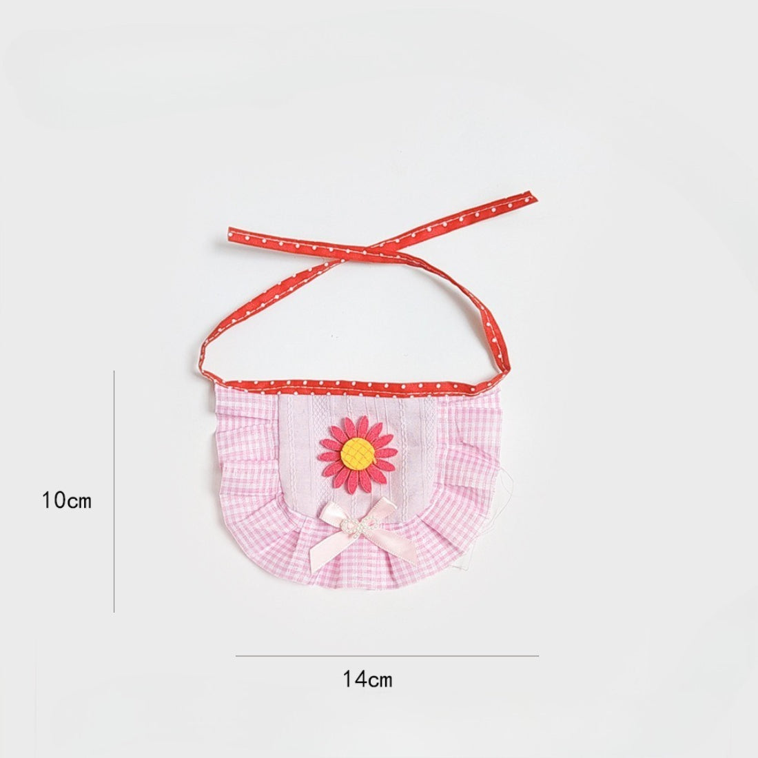 Side view of Mokka cat bib showing adjustable strap and ruffles