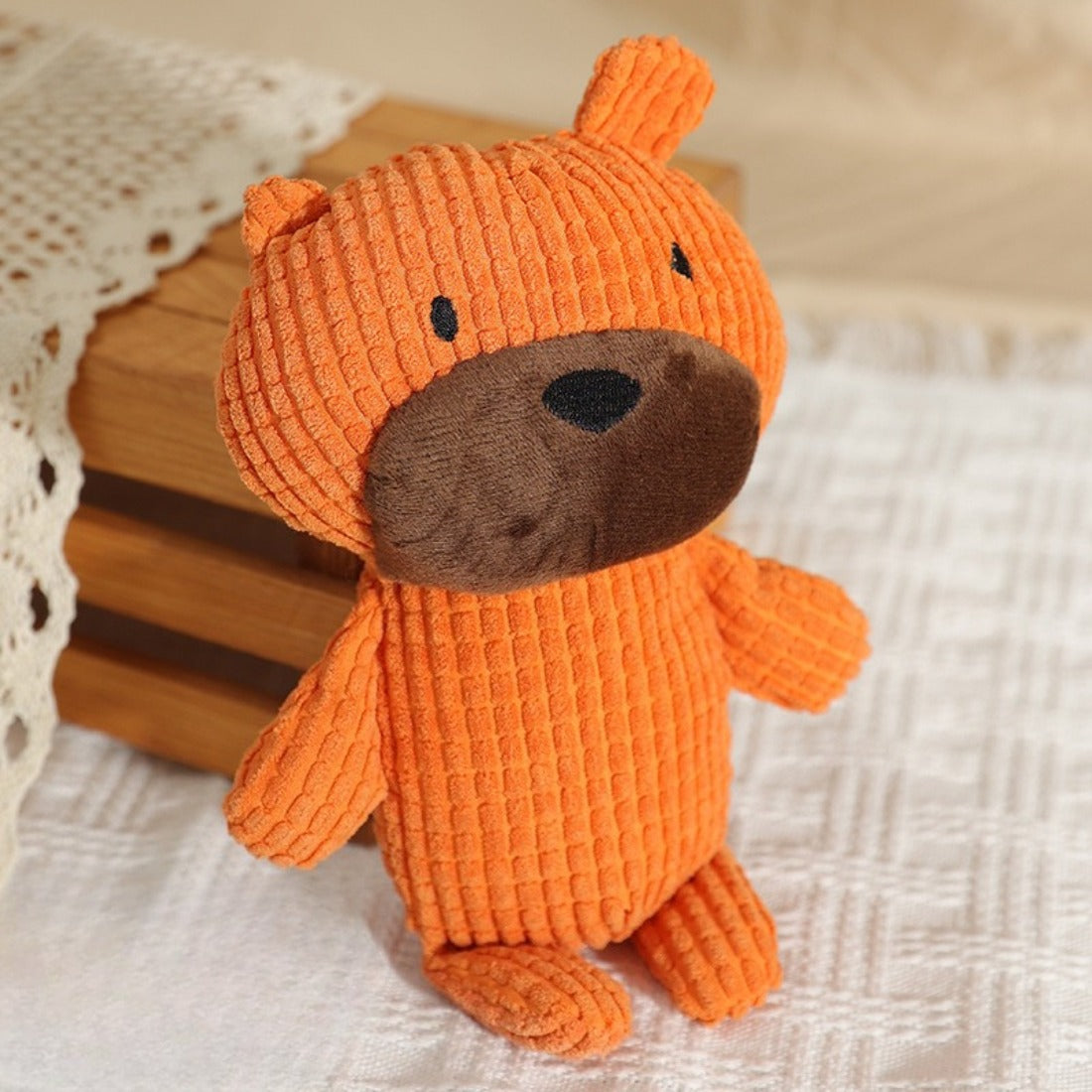 Petkin textured bear plush dog toy lying on white background showing full body