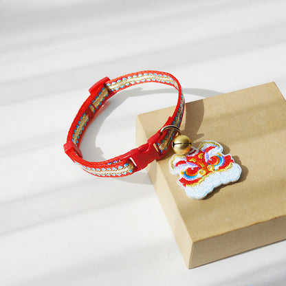 Mokka cat collar showing the tiger head charm attached to the band