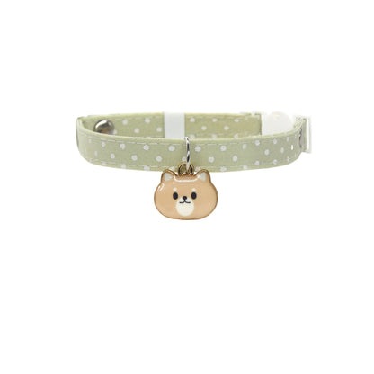 Pink collar with Mokka cat face charm and bell shown on white background