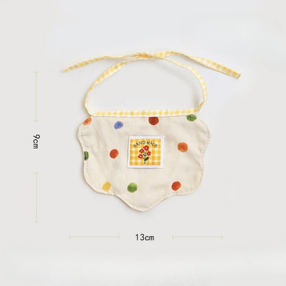 Side view of cat wearing Mokka Colour Spot Cat Neck Bib with visible spot design