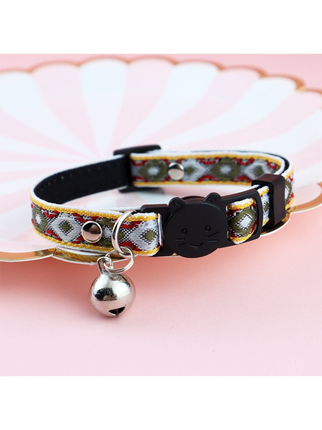 Side view of Mokka diamond weave bell cat collar highlighting silver bell and clasp