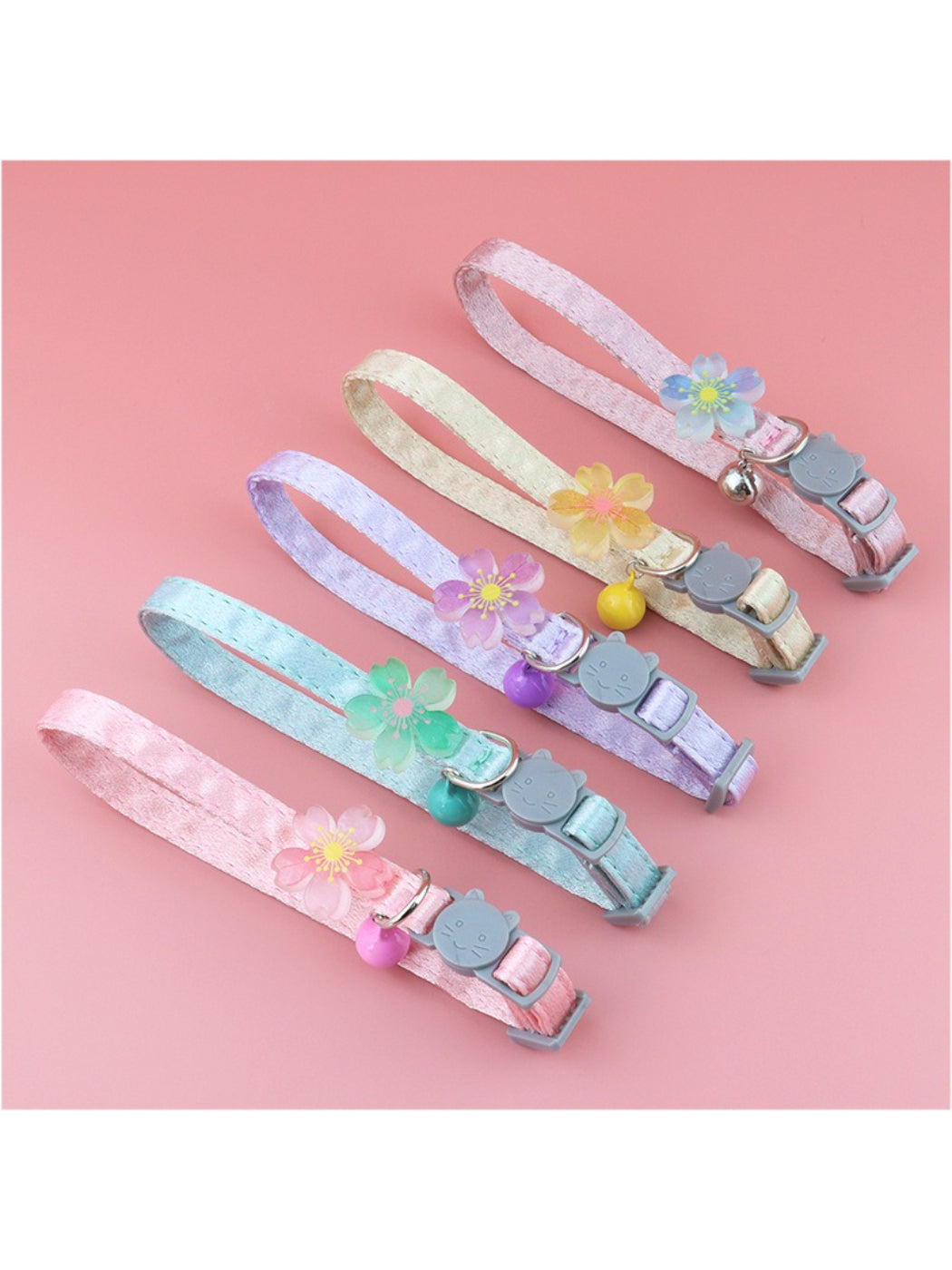 Close-up of pastel flower pattern on the Mokka cat collar with attached bell