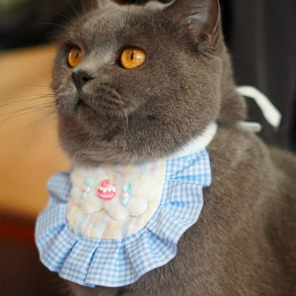 Close-up of Mokka Cake Charm Cat Bib showing detailed cat and cake embroidery