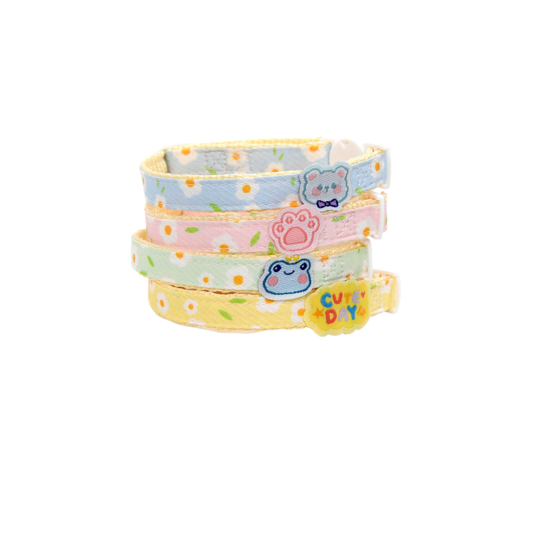 Close-up of white daisy charm attached to brown breakaway cat collar