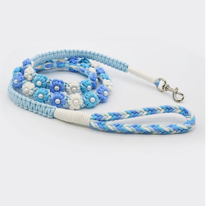 Loofie floral braided dog leash partially uncoiled on white background