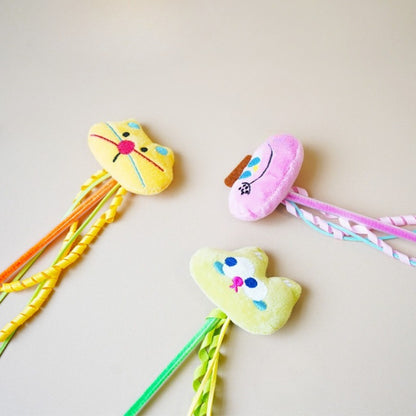 Close-up of Moo plush cat teaser wand showing detailed stitching and fabric texture