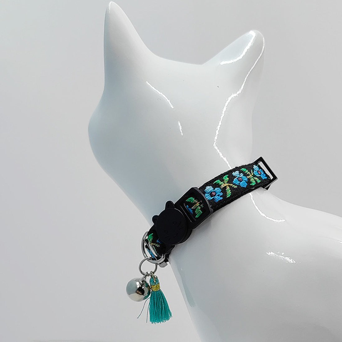 Mokka floral cat collar with tassel and bell displayed from above