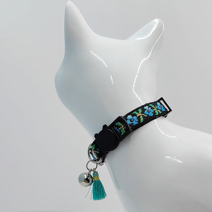 Mokka floral cat collar with tassel and bell displayed from above