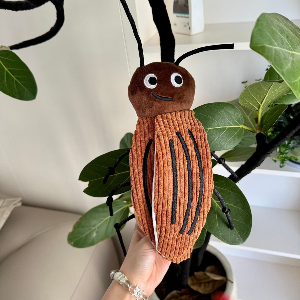 Plush ladybug cat toy with red body and black spots, designed for cats