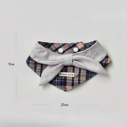 Side view of a cat wearing the Mokka layered plaid bib showing fit and design