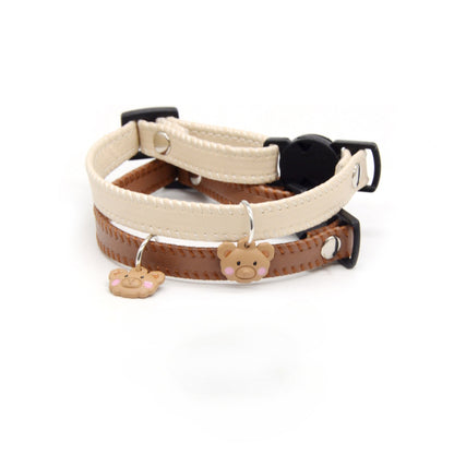 Mokka bear charm on adjustable brown leather breakaway cat collar shown on white background