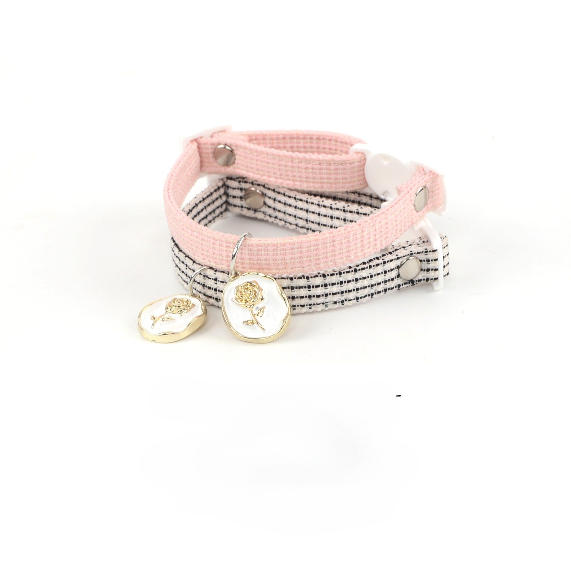 Side view of pink breakaway cat collar with rose-shaped charm attached