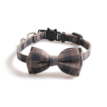 Mokka soft plaid bow tie cat collar with bell in natural lighting