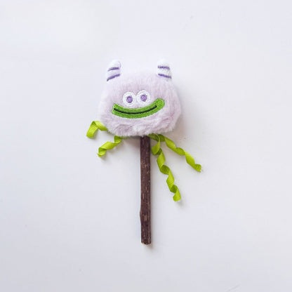 Moo monster cat toy held by hand showing size and feather details