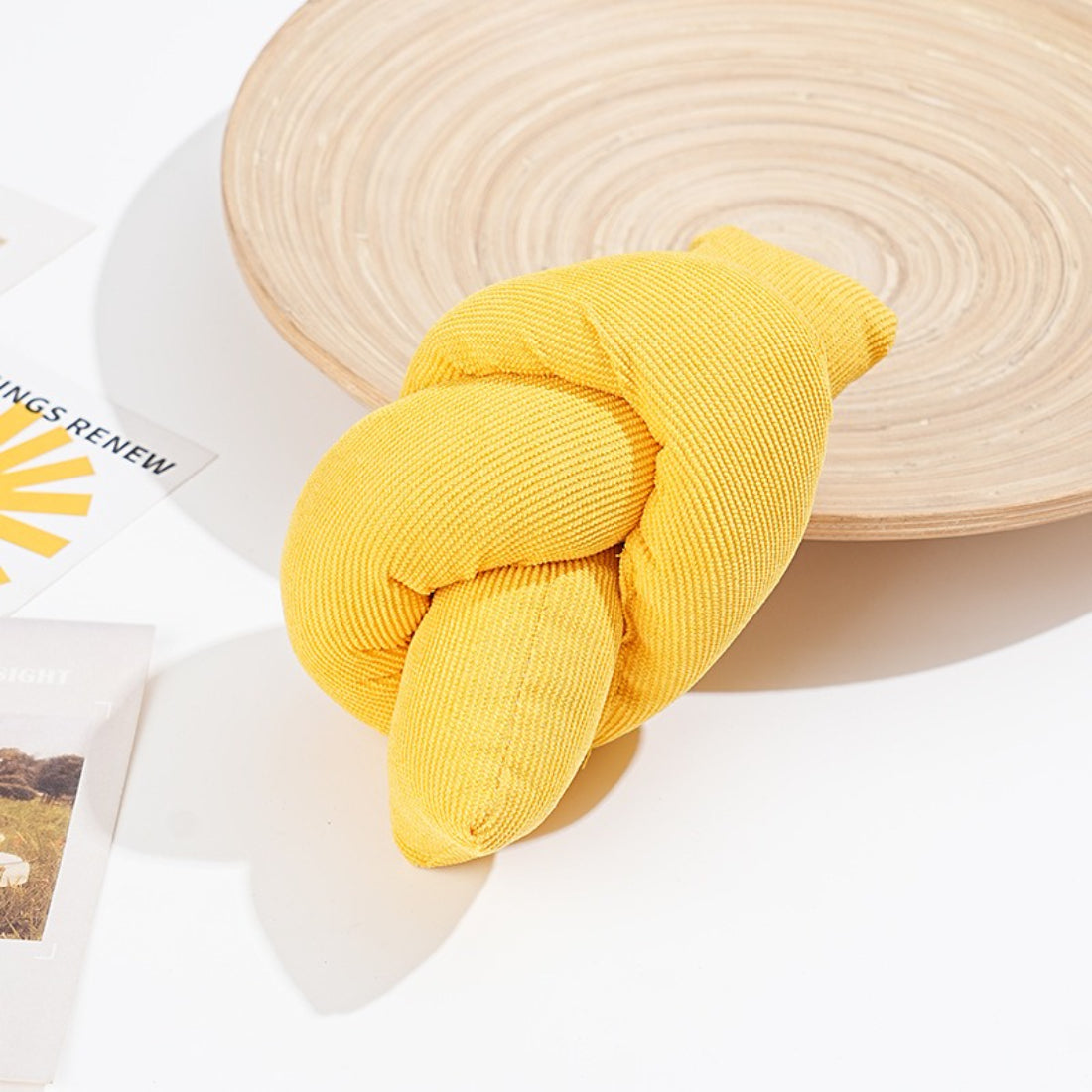 Moo Knot Plush Cat Toy held in hand to show size and plush material