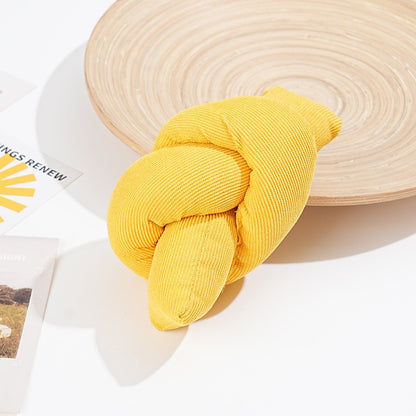 Moo Knot Plush Cat Toy held in hand to show size and plush material