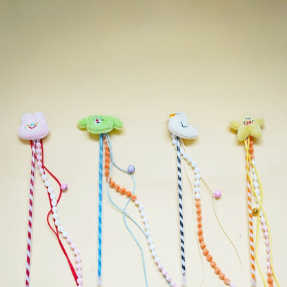 Moo plush cat teaser wand with colorful beads on a white background