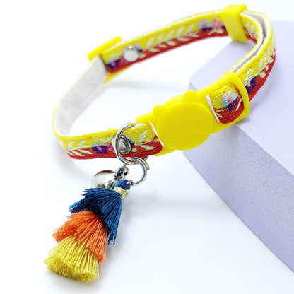 Mokka floral cat collar with tassel and bell wrapped in a circular shape