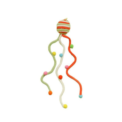 Moo interactive toss cat toy in multiple bright colors arranged for display