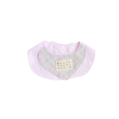 Pastel gingham cat bib folded neatly showing the pattern and fabric quality