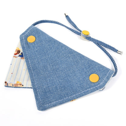 Close-up of Mokka cat bandana collar with cartoon cat print on fabric