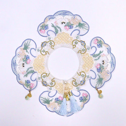 Side view of Mokka embroidered blossom collar on a garment emphasizing floral embroidery