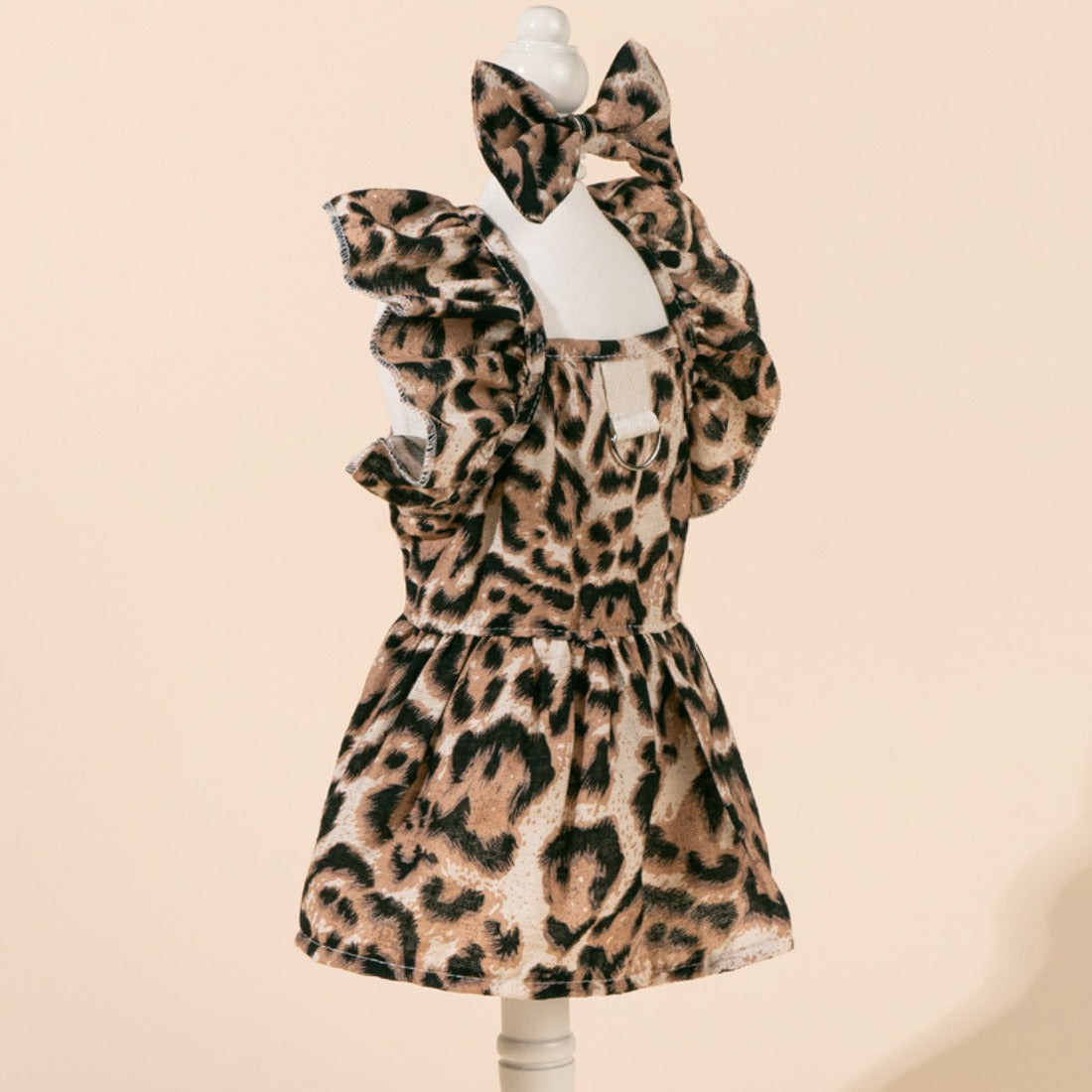 Close-up of the bow tied on the back of the leopard dog dress
