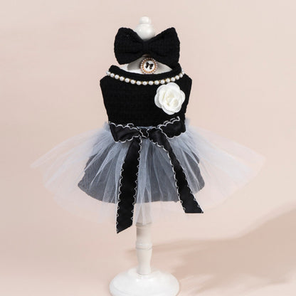 Side view of Ozzie cat in a tulle dress with bow detail on the back