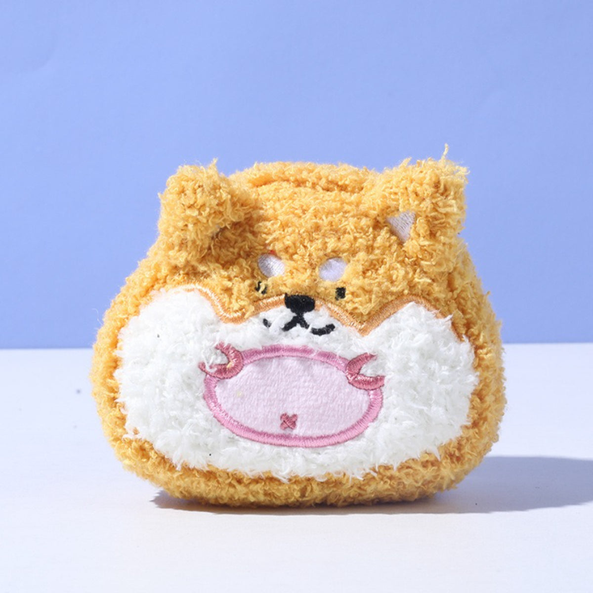 Close-up of Petkin flat plush dog toy showing soft fabric and stitched facial details