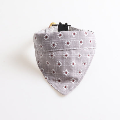 Mokka floral cat collar displayed in bandana style on a flat surface