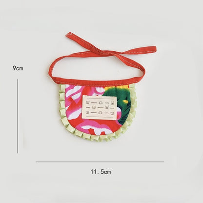 Mokka cat bib worn by a cat, highlighting fit and ruffle design around the neck