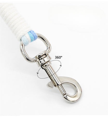 Loofie floral braided dog leash coiled with metal clip in focus