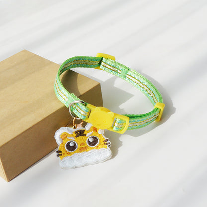 Tiger head charm detail on Mokka cat collar with visible texture