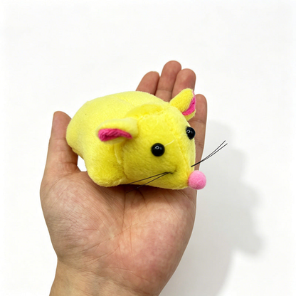 Yellow mouse cat toy resting on an open palm