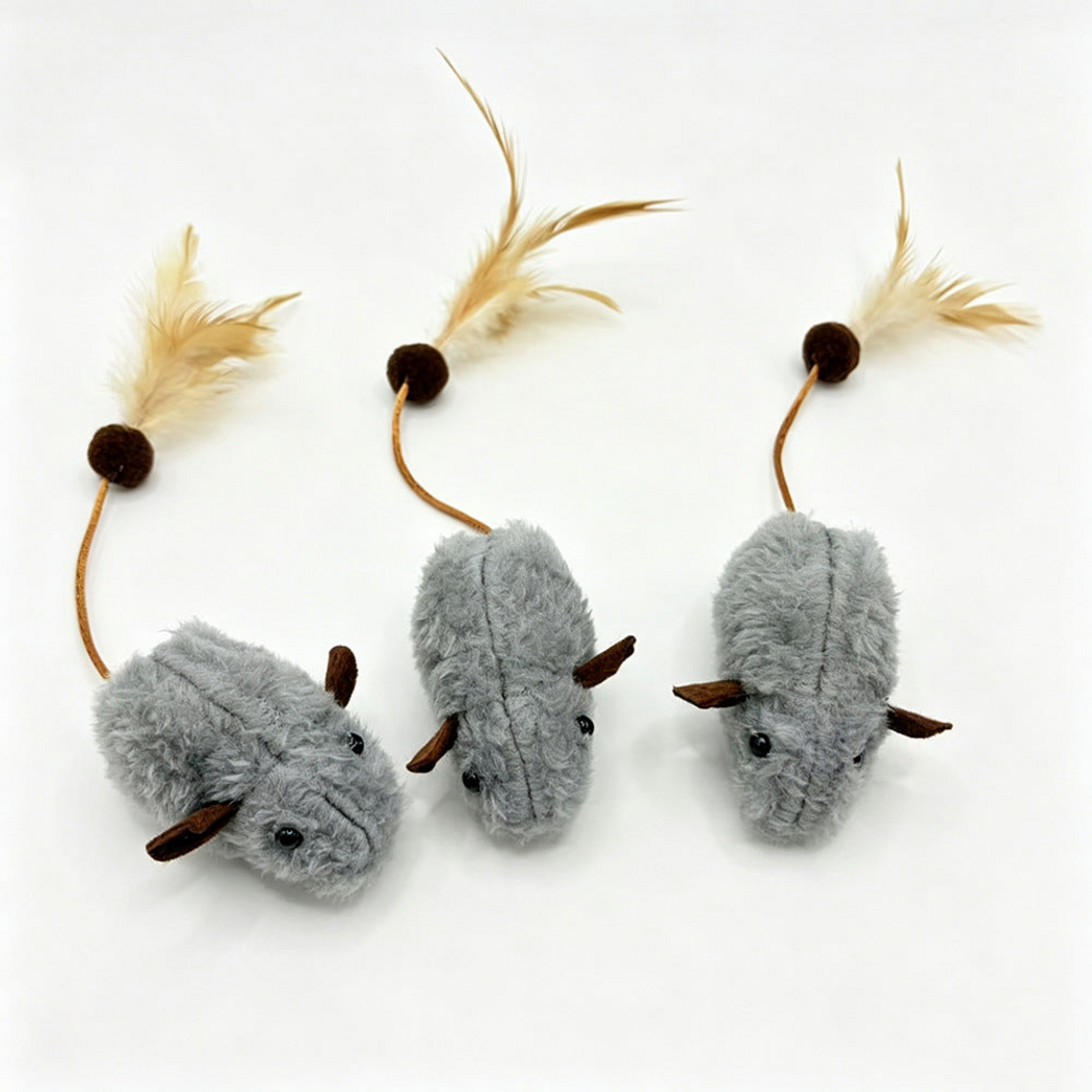 Gray mouse-shaped cat toys with cord and feather tails, overhead view