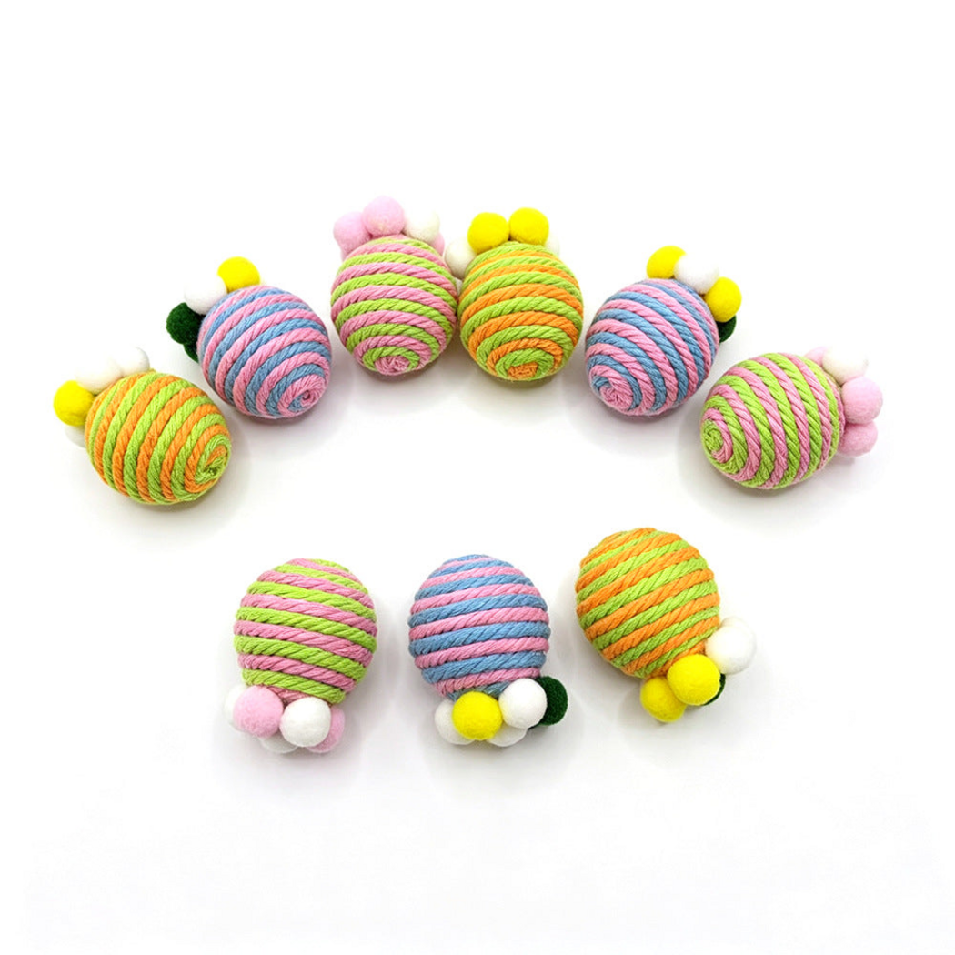 Striped cat toys arranged in an arc with three toys in the foreground