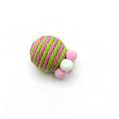 Green cat toy with pink and green striped wrapping and pink and white pom-poms